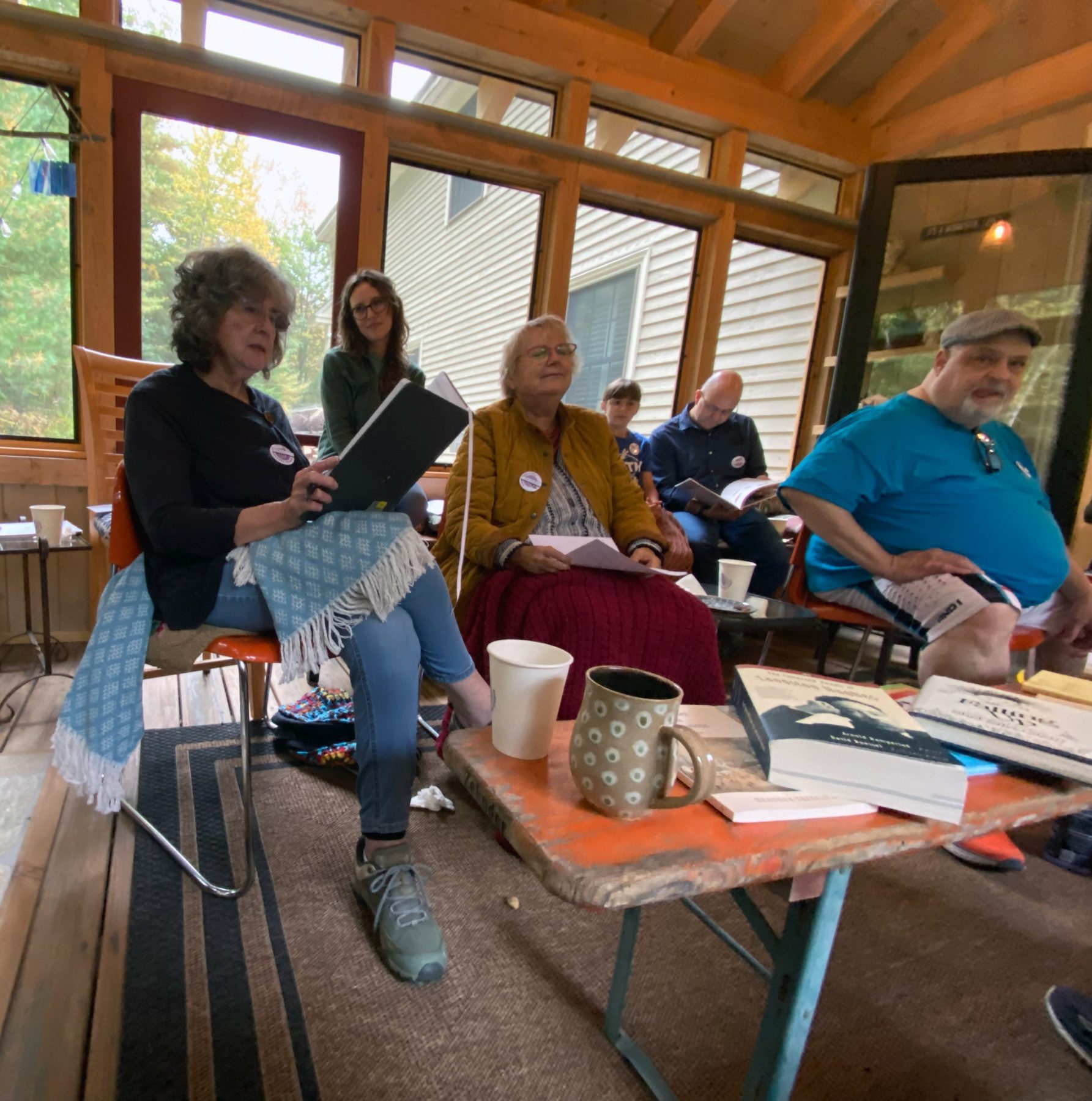 Group of people reading poetry